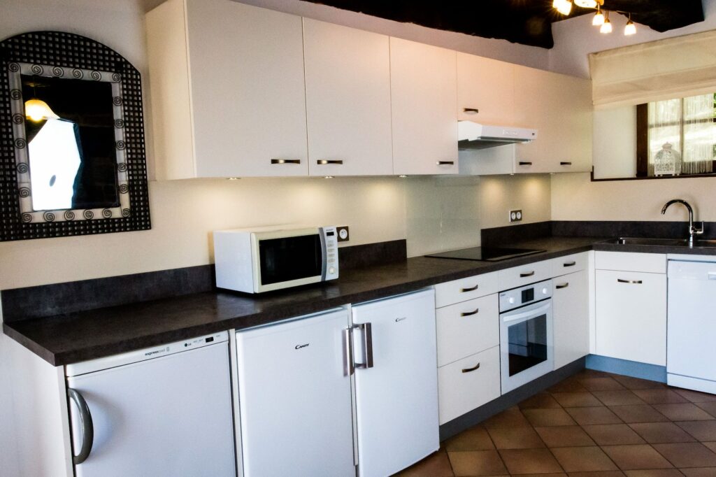 Fully equipped kitchen with oven, hob, 2 under counter fridges and an undercounted freezer.